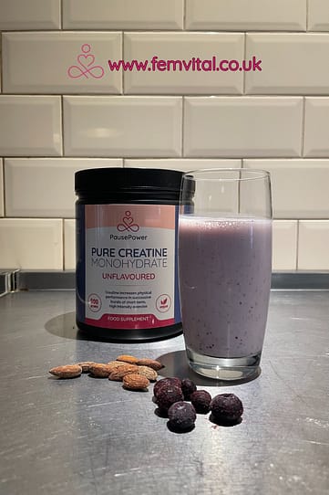 PausePower Creatine powder stirred into berry smoothie for menopause strength breakfast